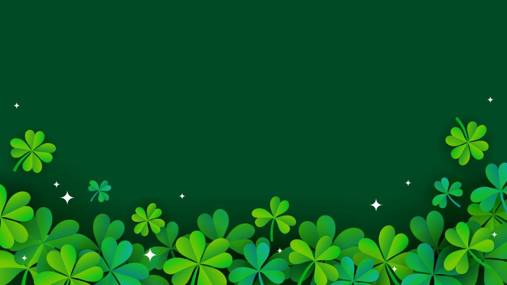A dark green background with a border of various sizes of bright green clovers at the bottom. Tiny white stars are scattered among the clovers, creating a festive and vibrant appearance.